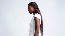 Load image into Gallery viewer, White asymmetric sleeve top with gold clasp detail
