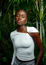 Load image into Gallery viewer, White asymmetric sleeve top with gold clasp detail
